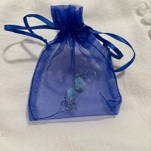 Silver earrings with a light blue stone. NWOT